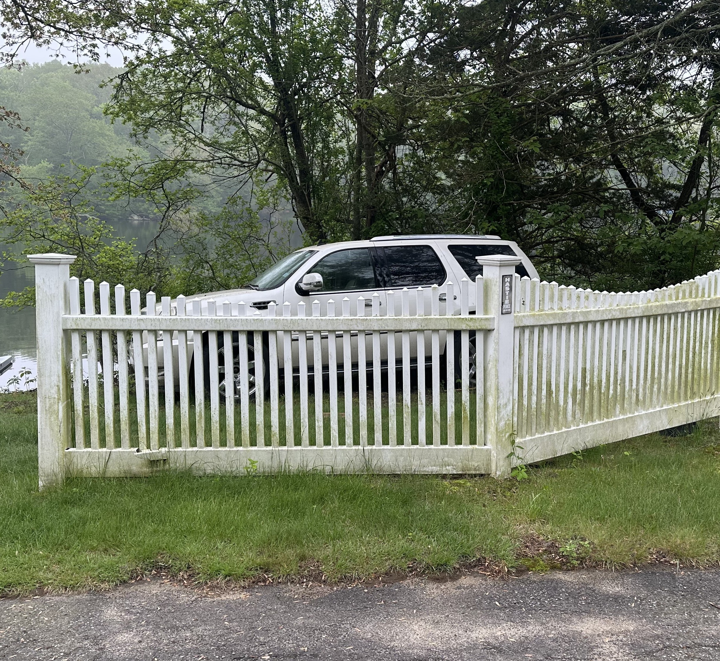 Second fence before pressure washing Voluntown CT - dirty and weathered with stains